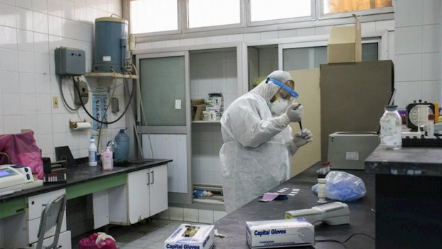 ep 21 may 2020 egypt giza a picture made available on 23 may 2020 shows a medic analysing swabs