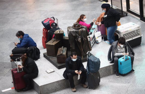 ep archivo   viajeros esperan en un asiento de la estacion de tren de atocha