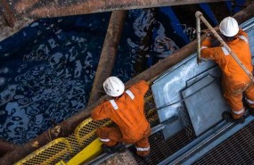 oil rig workers drilling offshore oil rig workers drilling offshore