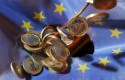 ep filed - 04 july 2011 baden-wuerttemberg karlsruhe one euro coins will fall onto an euflag the