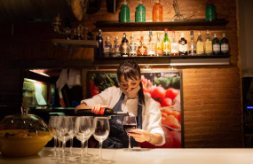 ep archivo   una camarera sirve una copa de vino en el interior de un bar de barcelona