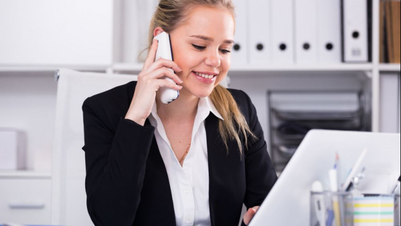 1624036292 woman talking phone office