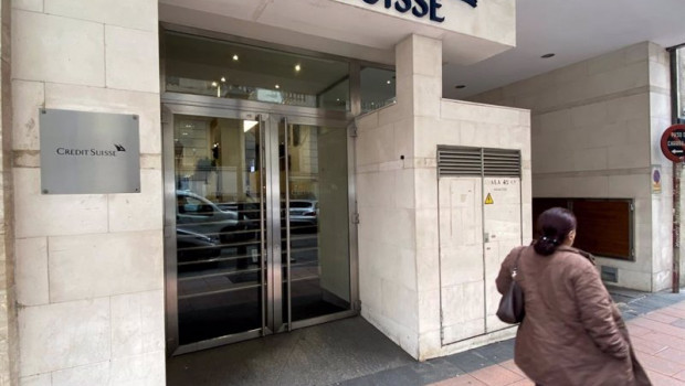 ep archivo   una mujer pasa junto a la entrada de la sede de credit suisse en madrid espana a 29 de