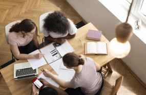 college girls studying together 