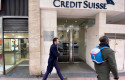 ep archivo   dos hombres pasan junto a la entrada de la sede de credit suisse en madrid espana a 29