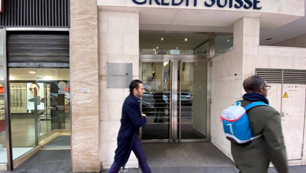 ep archivo   dos hombres pasan junto a la entrada de la sede de credit suisse en madrid espana a 29