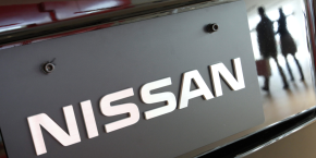 visitors are reflected in a nissan motors vehicle at the company s global headquarters in yokohama 