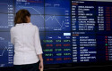 ep a woman looks at the digital market boards at the australian stock exchange asx in sydney friday