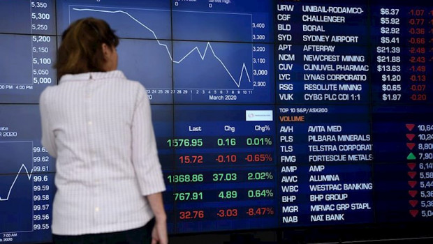 ep a woman looks at the digital market boards at the australian stock exchange asx in sydney friday